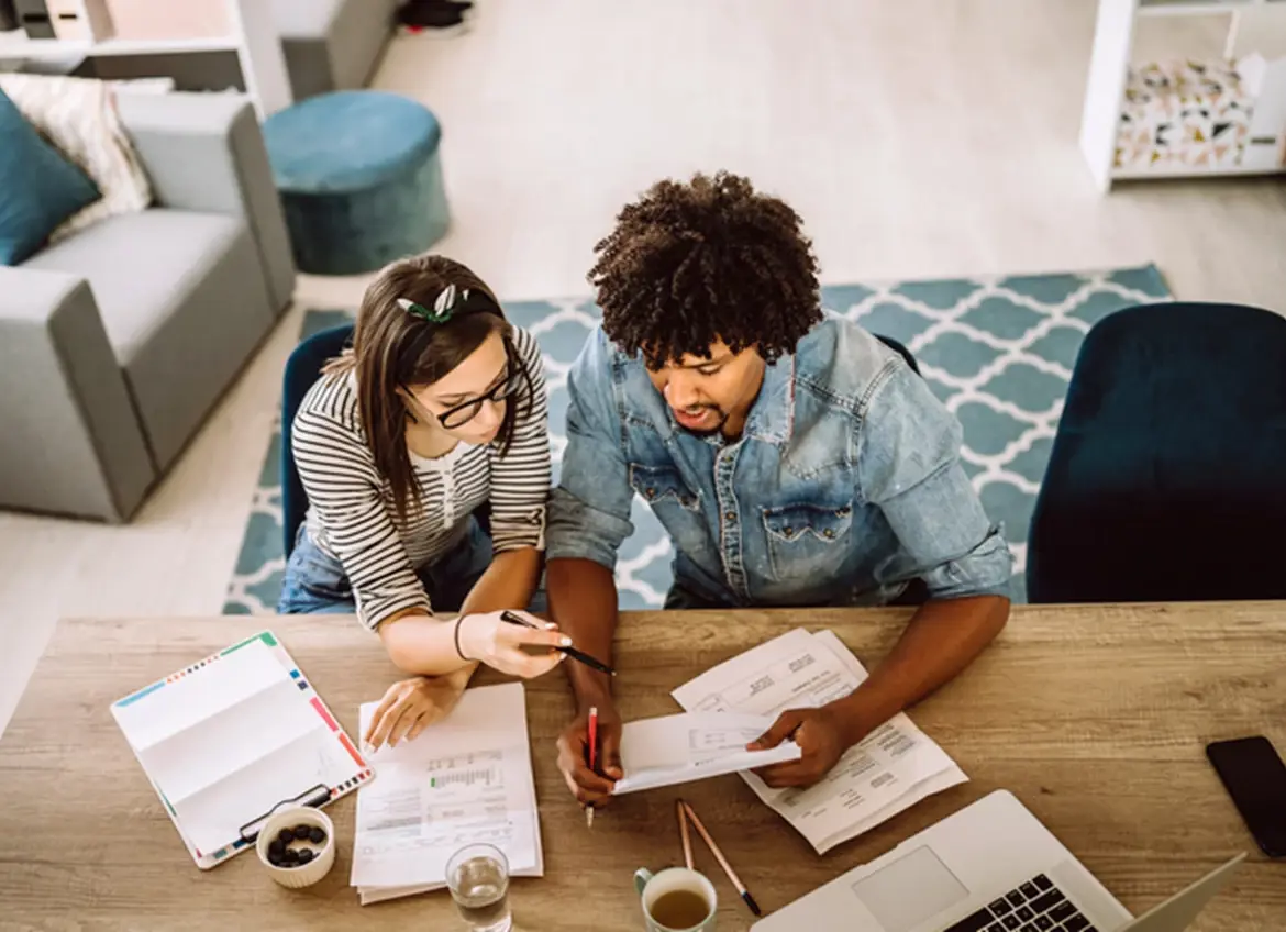 A couple reviewing bills together