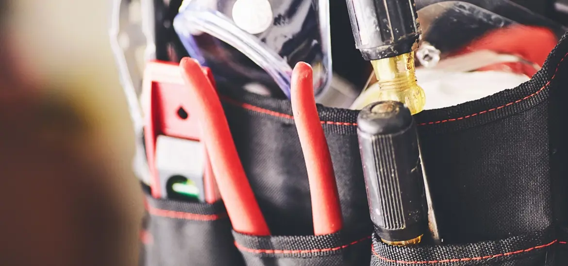 A tool bag filled with various tools