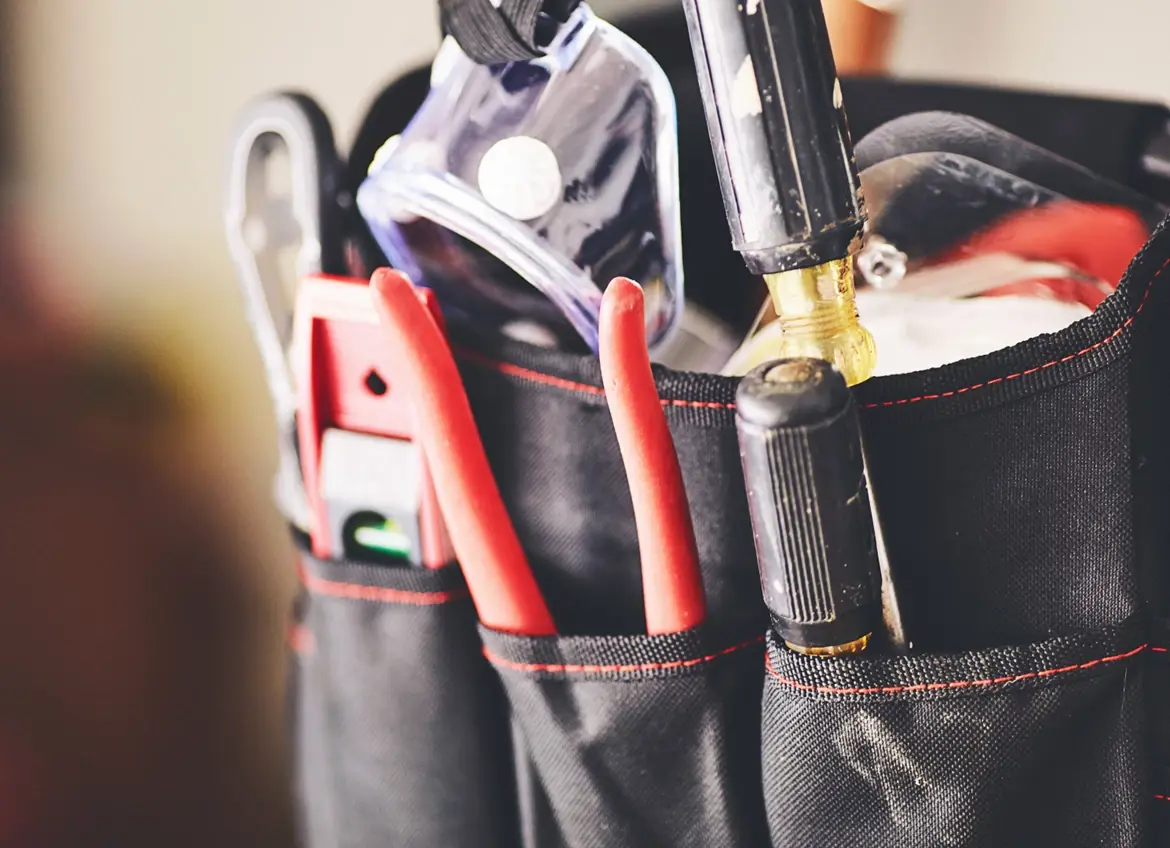 A tool bag filled with various tools