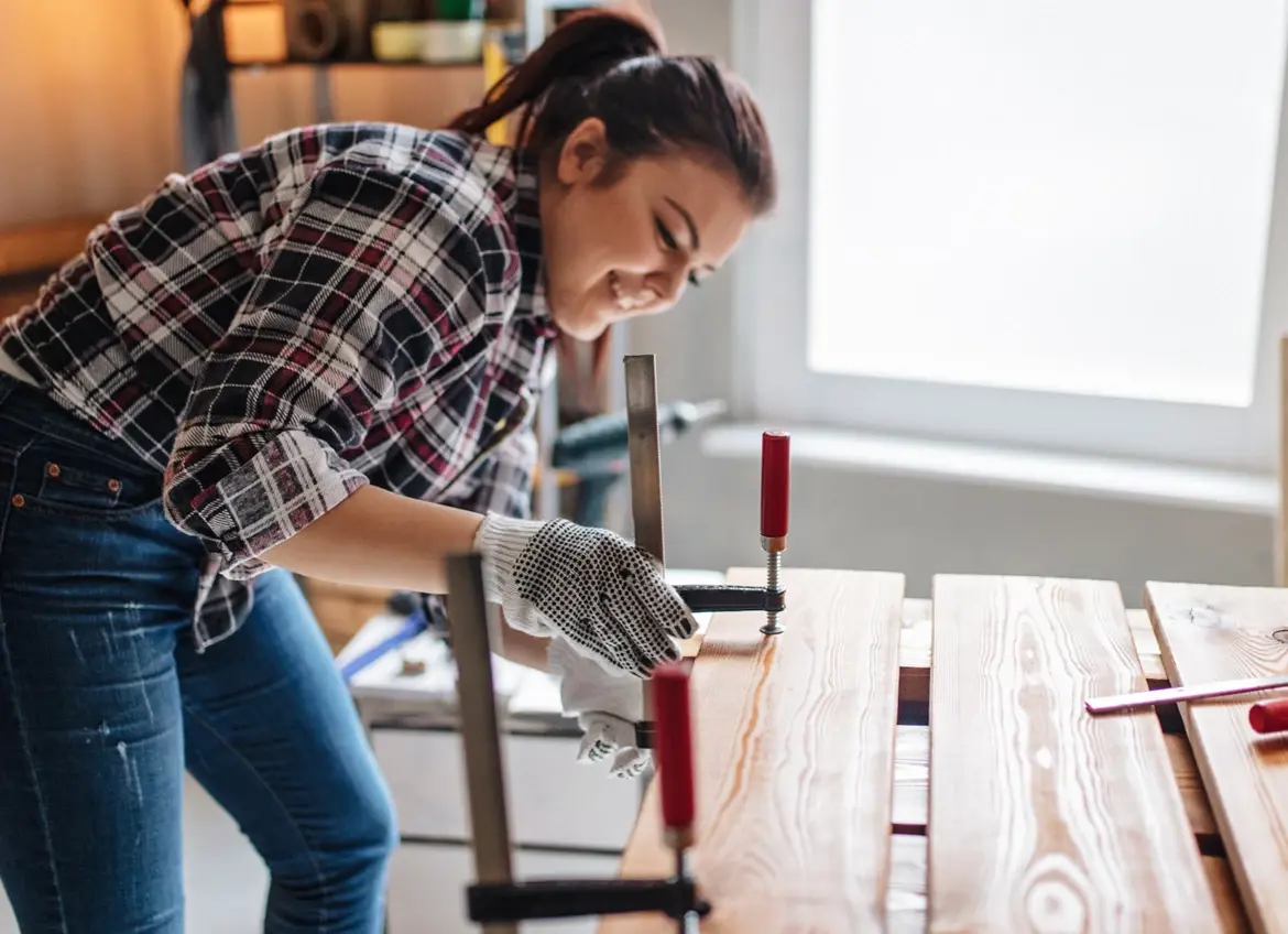 Woman working on her woodworking project