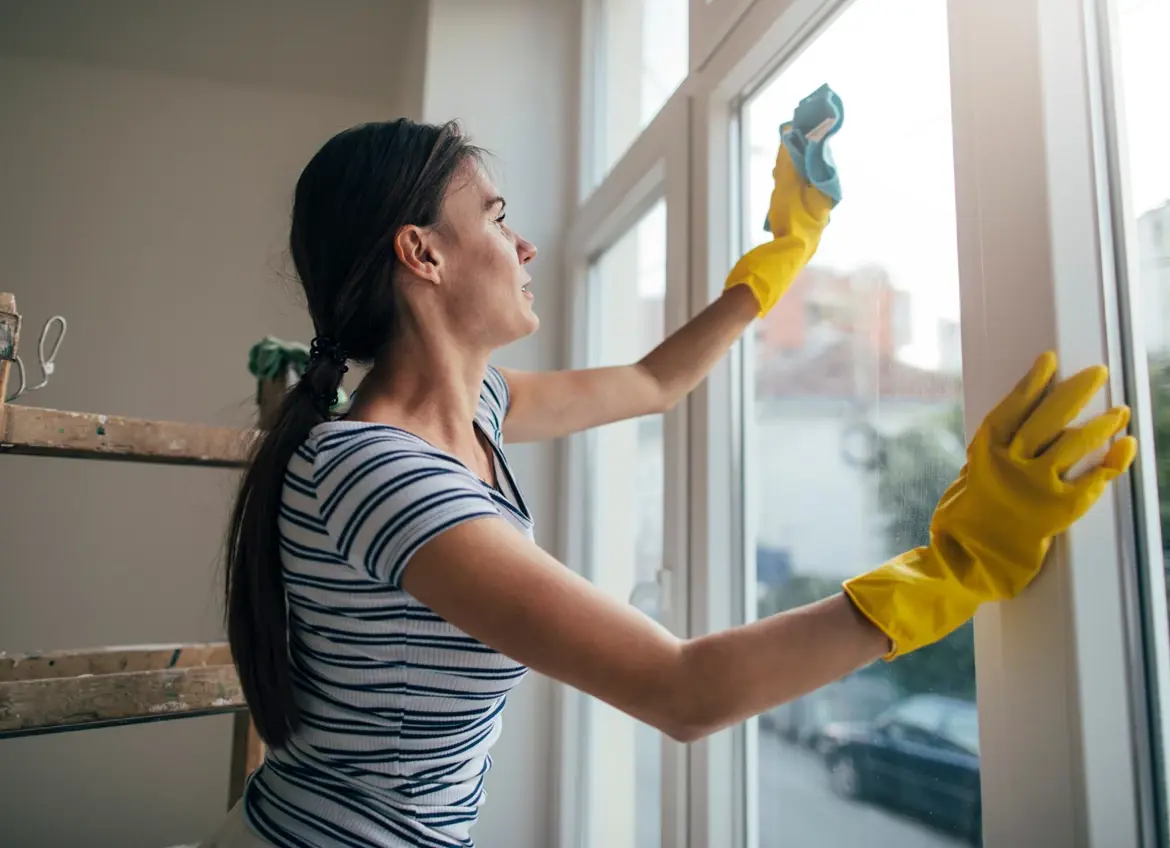 Woman cleaning windows