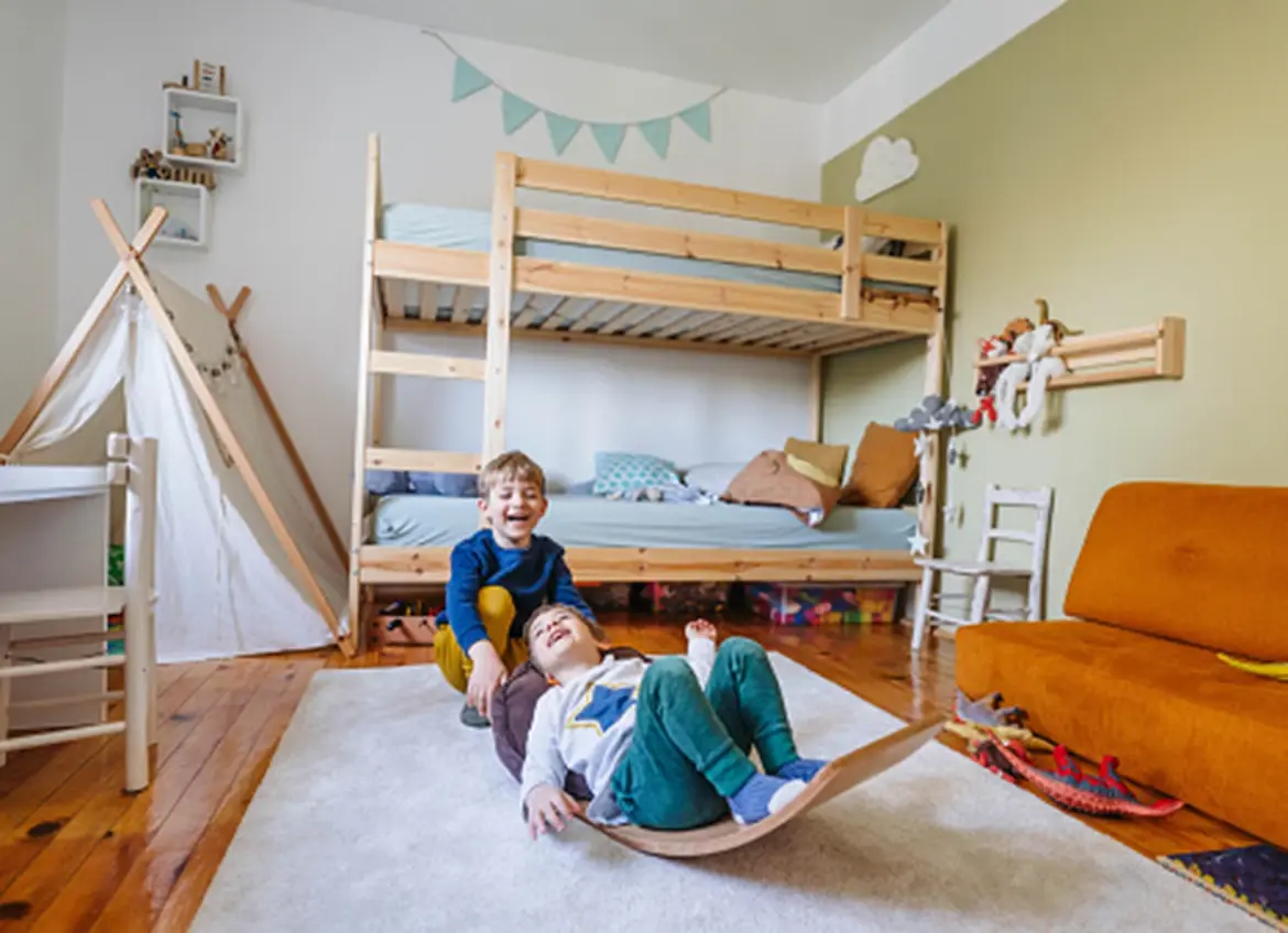 Two brothers playing in their room